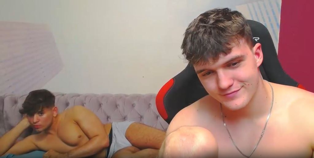 Gay cam stars Gabriel and Harper laying down in underwear