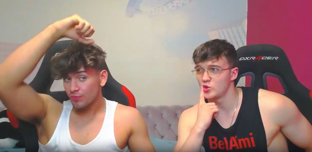 gay webcam models Gabriel and Harper flexing their biceps
