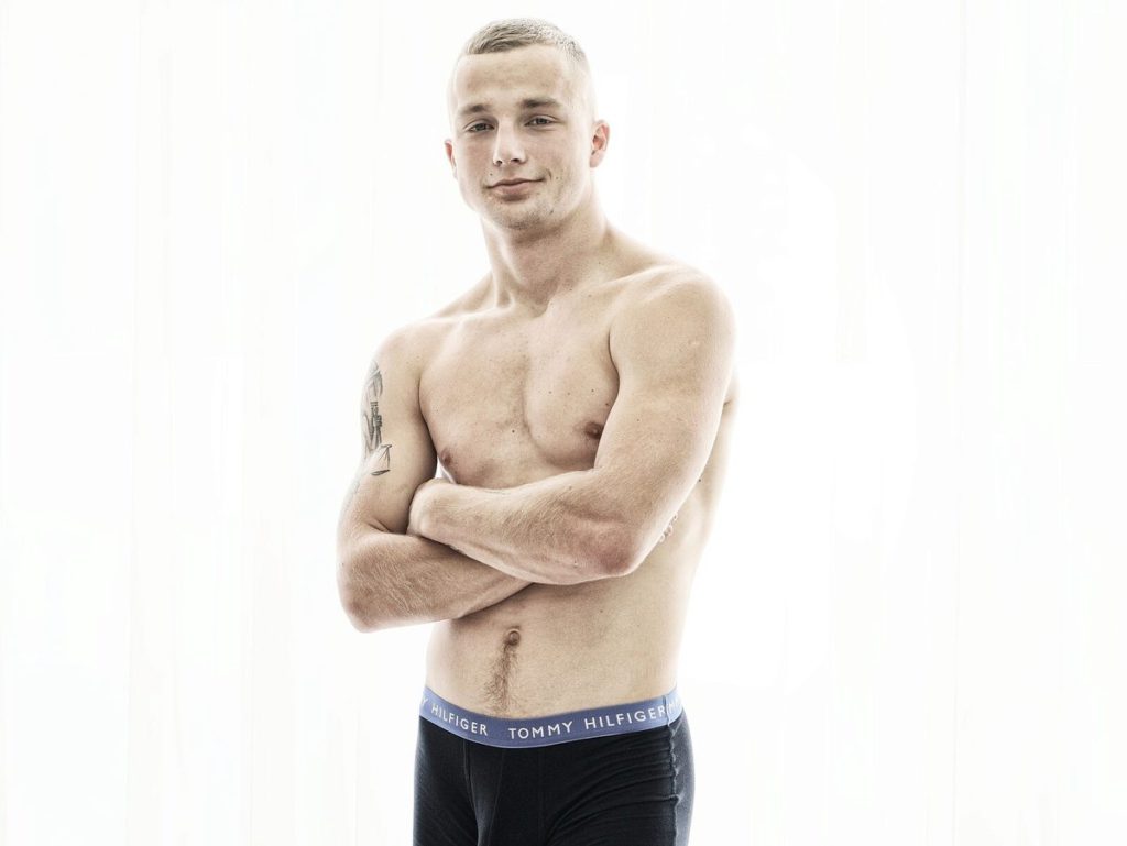 Gay cams model Randy Rollins poses in boxer-briefs.